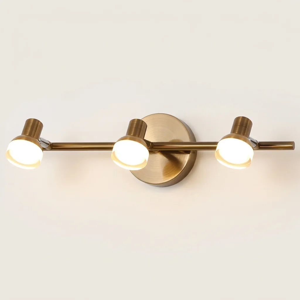 Applique miroir LED bronze à 3 spots orientables, allumée
