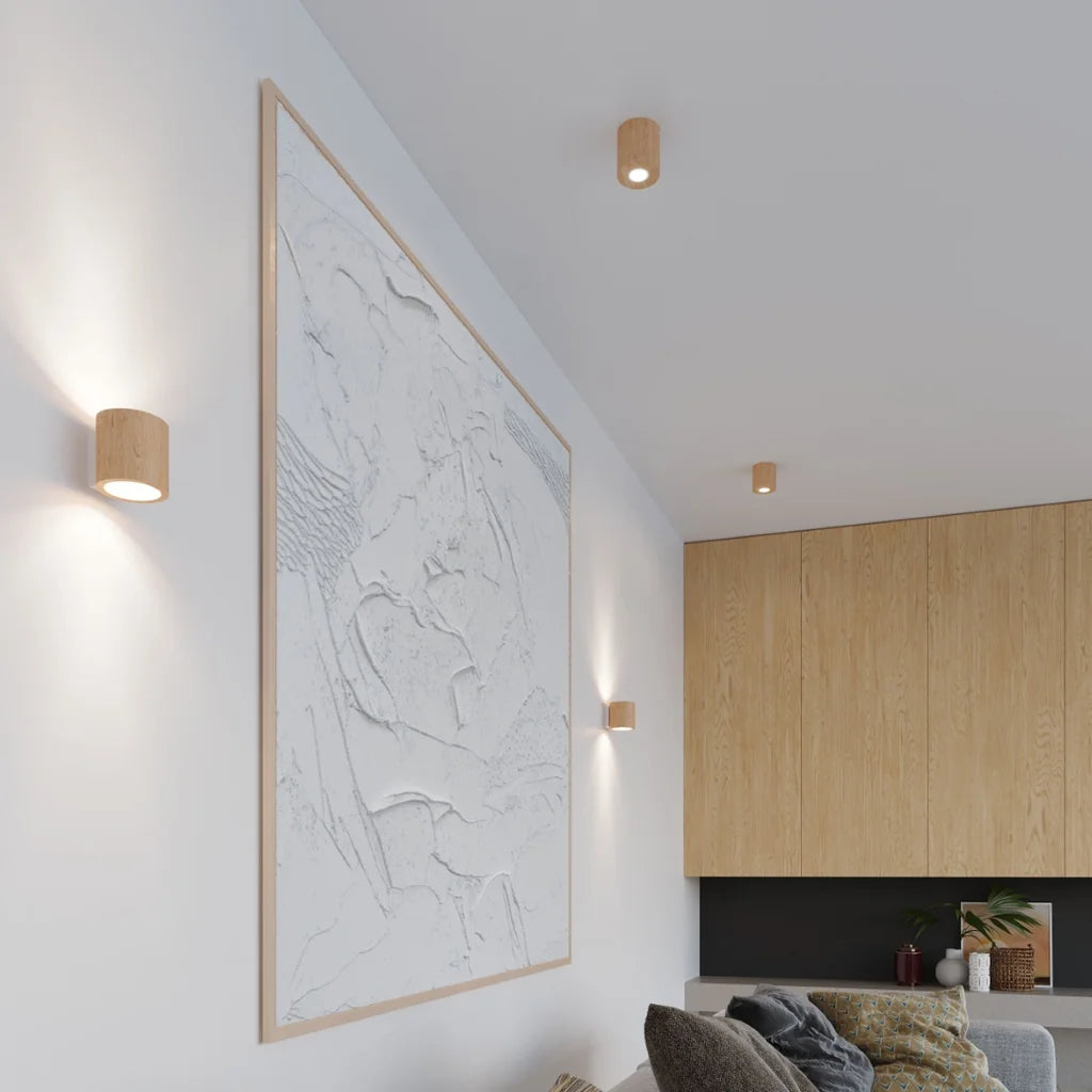 Applique murale cylindre haut et bas dans un salon