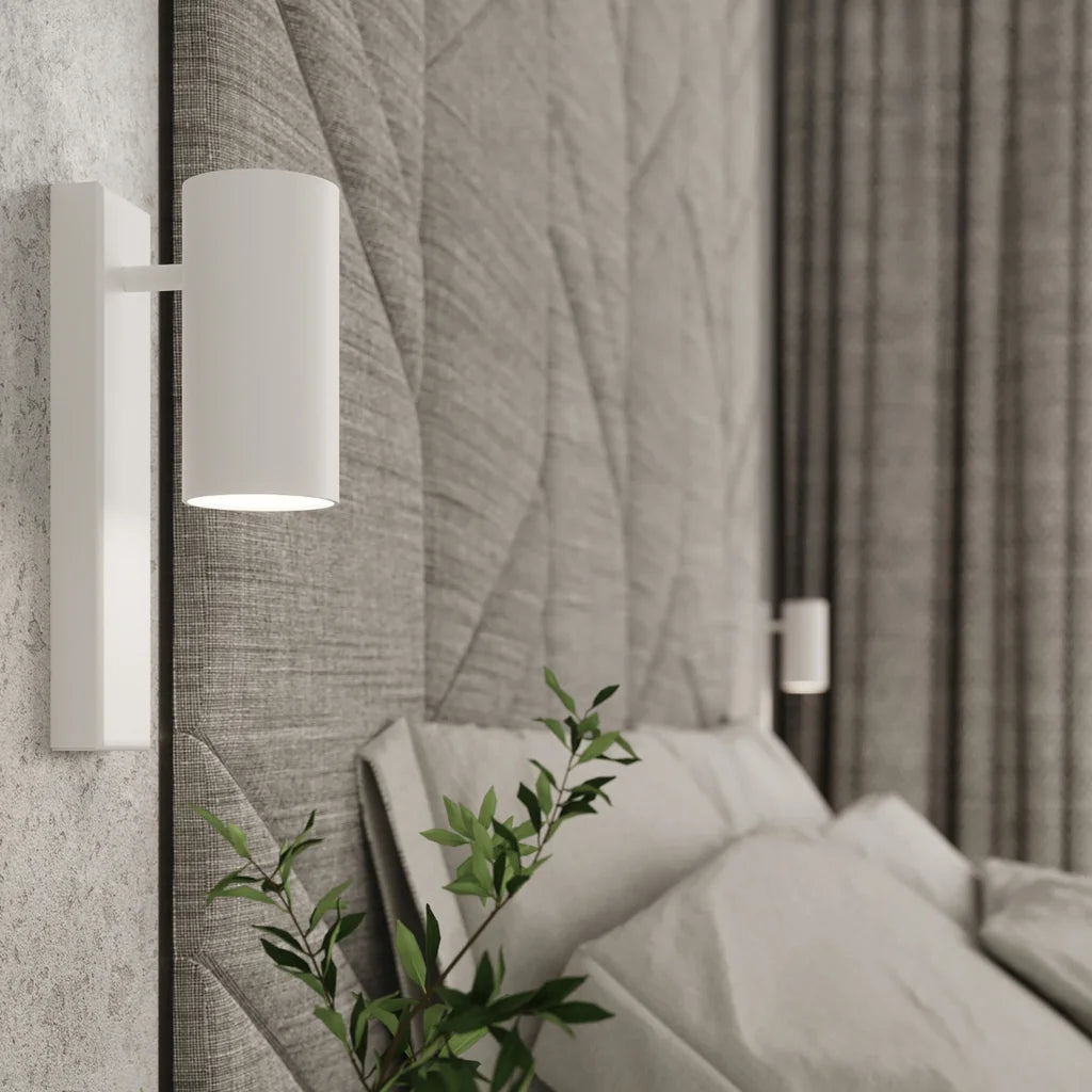 Applique murale cylindre sur platine dans une chambre