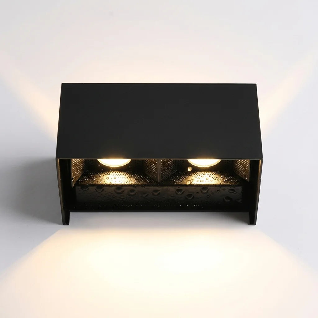 Deux sources lumineuses et réflecteur perforé vus de dessous