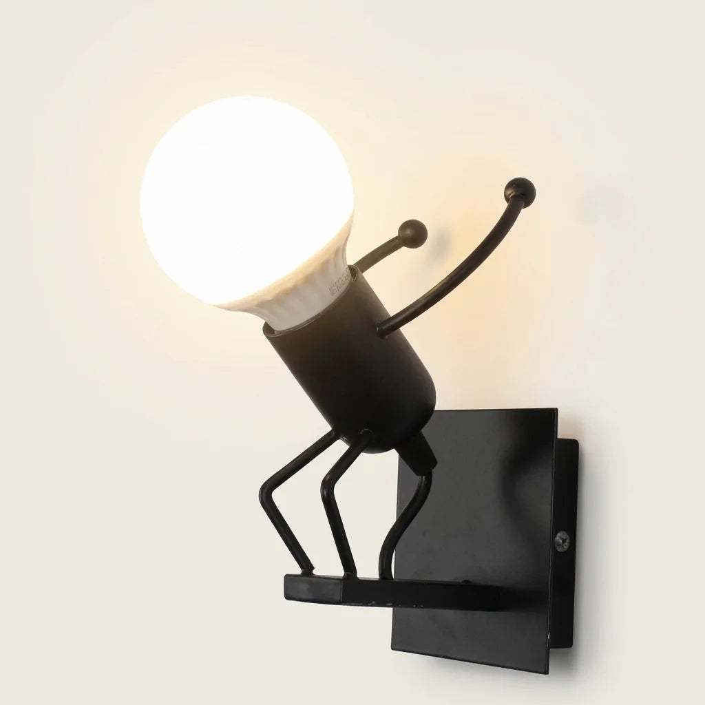Applique murale petit bonhomme noir en position de saut