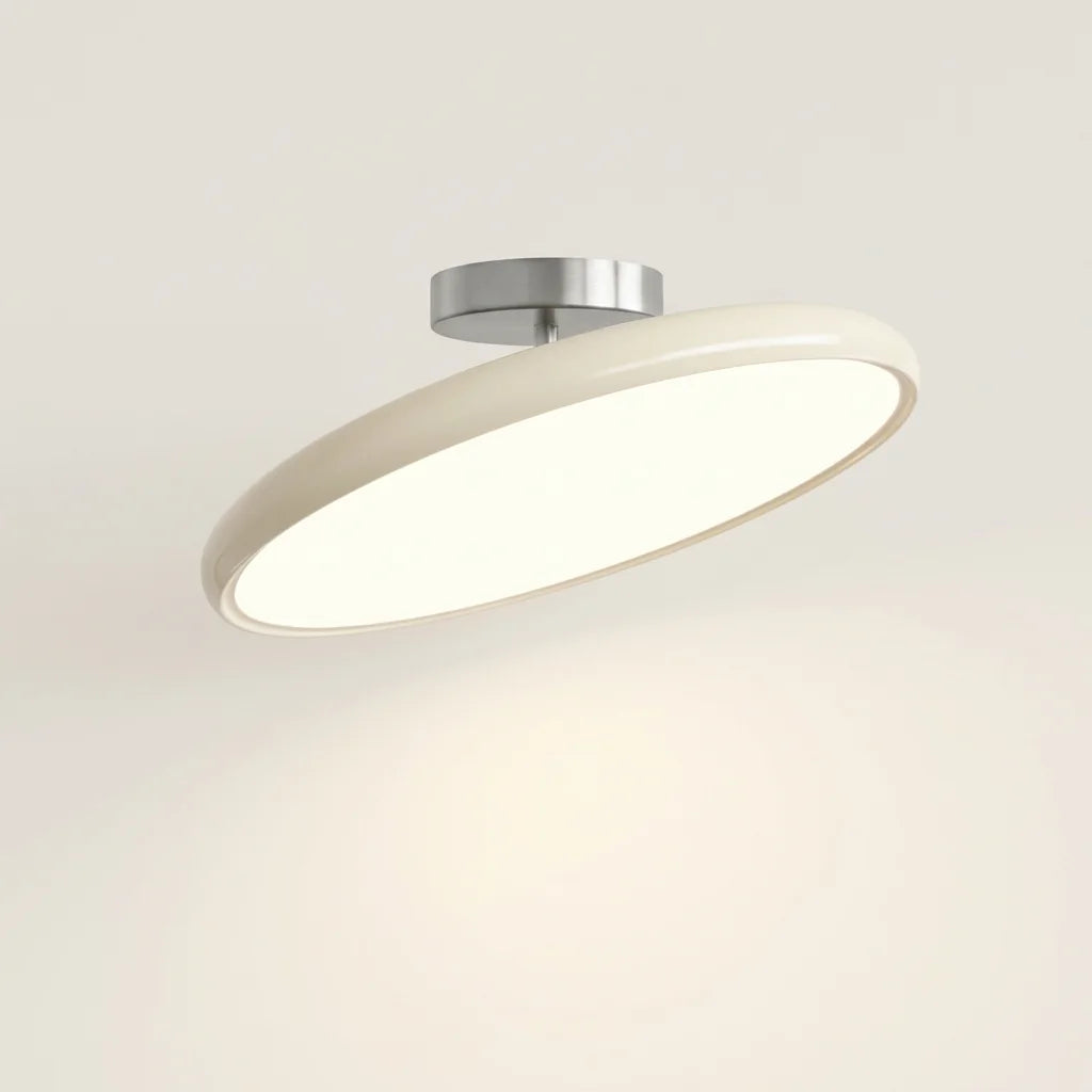 Plafonnier LED art déco en disque laqué crème, allumé