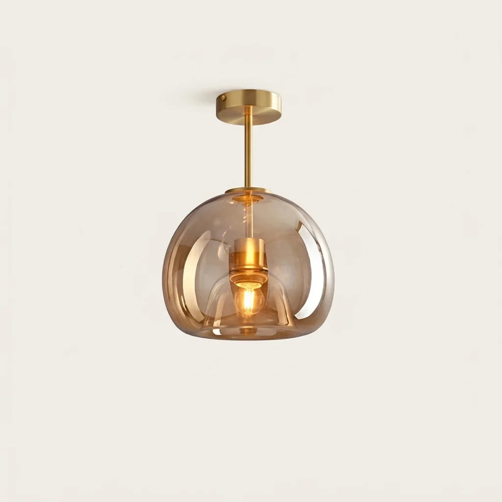 Plafonnier globe en verre cognac sur tige laiton