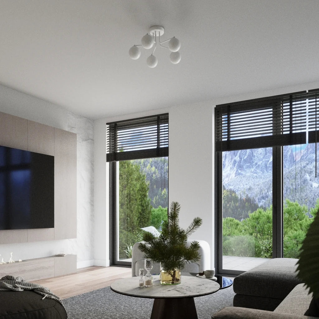 Plafonnier globes opalins sur bras coudés dans un salon