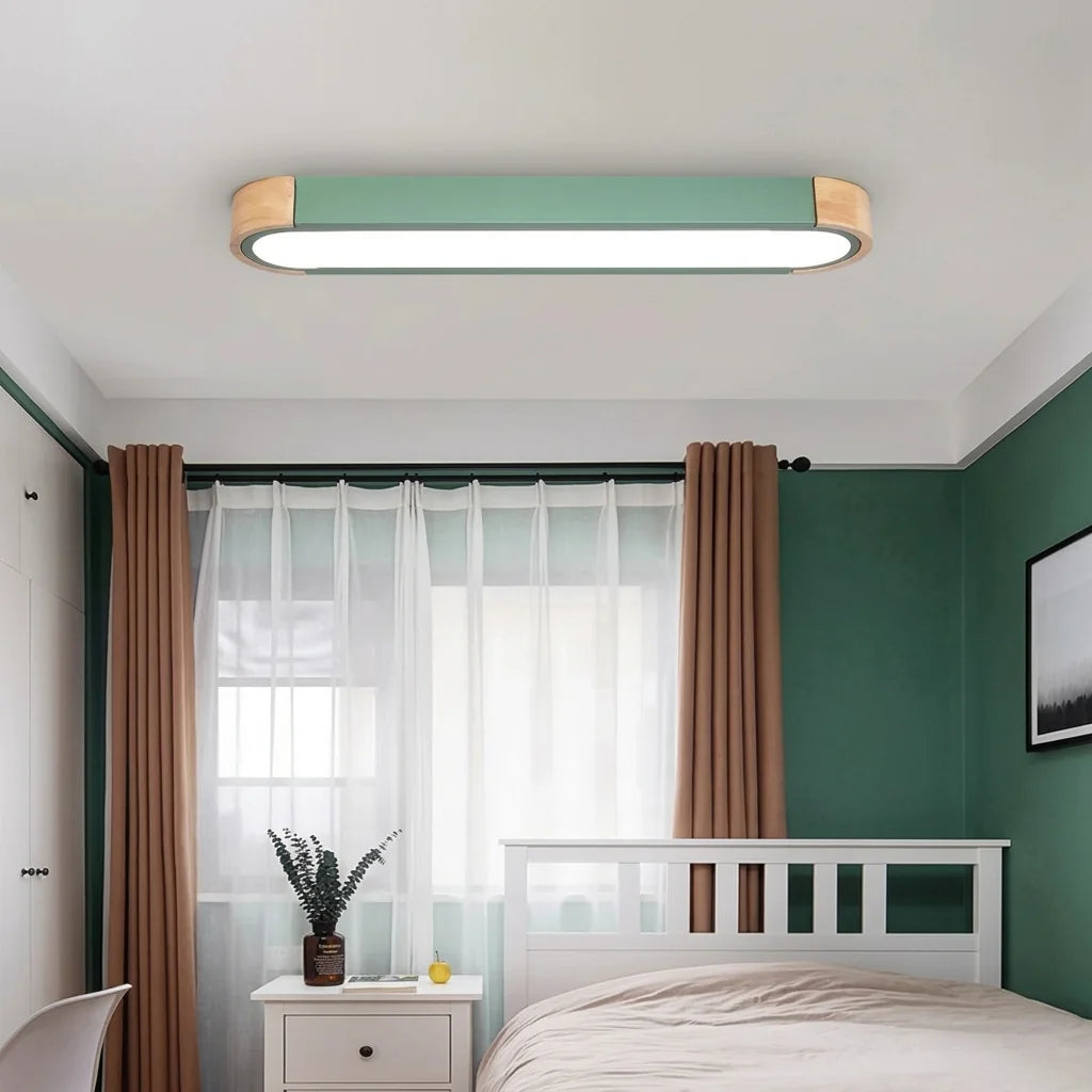 Plafonnier LED allongé vert dans une chambre paisible