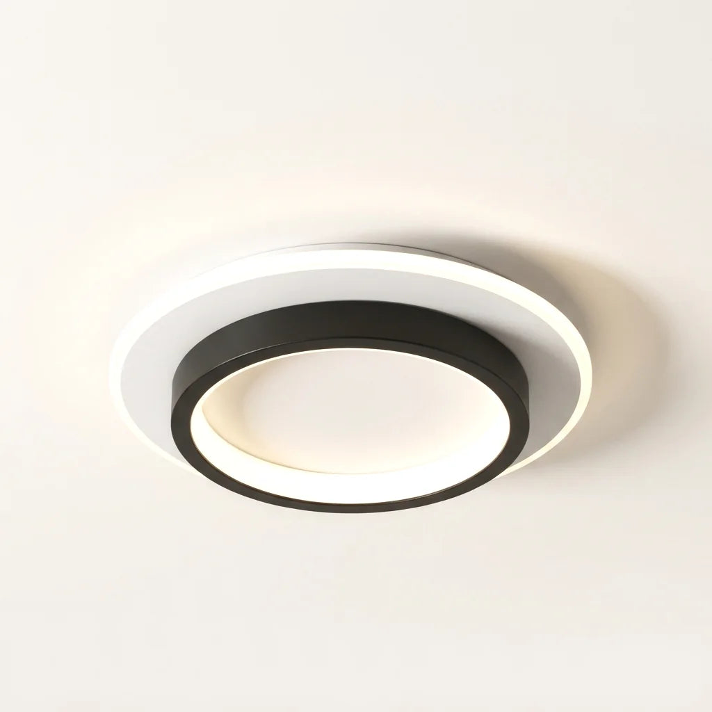 Plafonnier LED rond, anneau noir sur disque blanc lumineux