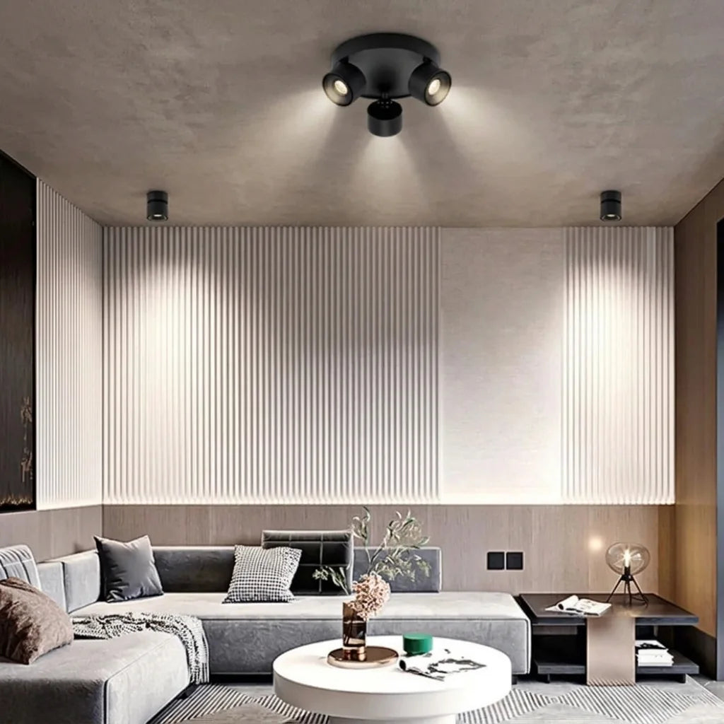 Spots LED orientables noirs dans un salon moderne