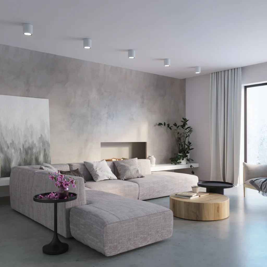 Spot plafond cylindre en béton ø 14 cm dans un salon
