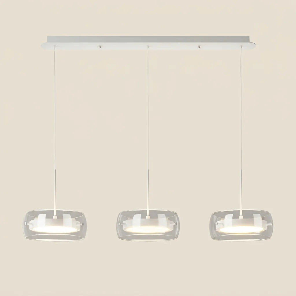 Suspension LED à trois globes de verre sur rail blanc, allumée